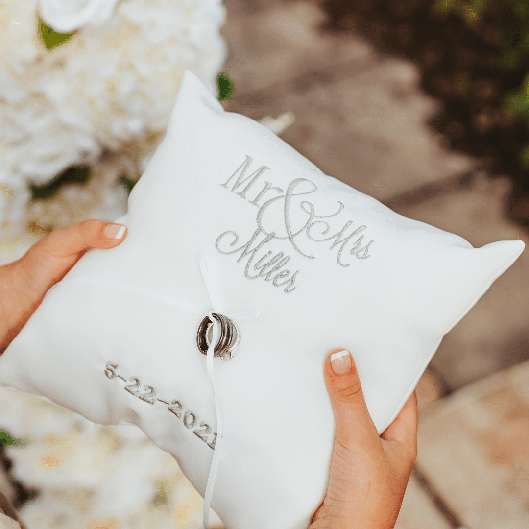 Looking for an elegant and personalized accessory for your wedding ceremony? Look no further than our custom embroidered wedding ring pillow! Made with high-quality