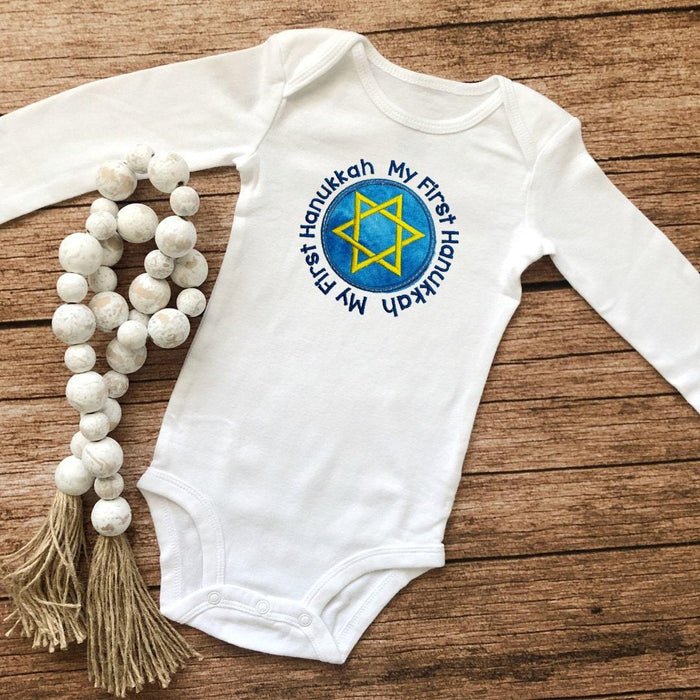 Celebrate Hanukkah with this Onesie®. It's the perfect onesie for baby's first Hanukkah. With machine embroidered design, this Onesie® will bring your little one gre