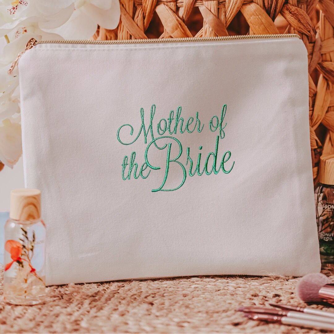 This white canvas makeup bag is a must-have accessory for any mother of the bride. Measuring 10.5" x 8" x 1", it's the perfect size to hold all of your makeup essent