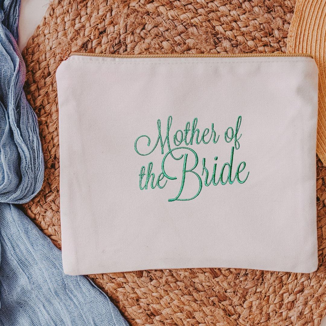 This white canvas makeup bag is a must-have accessory for any mother of the bride. Measuring 10.5" x 8" x 1", it's the perfect size to hold all of your makeup essent