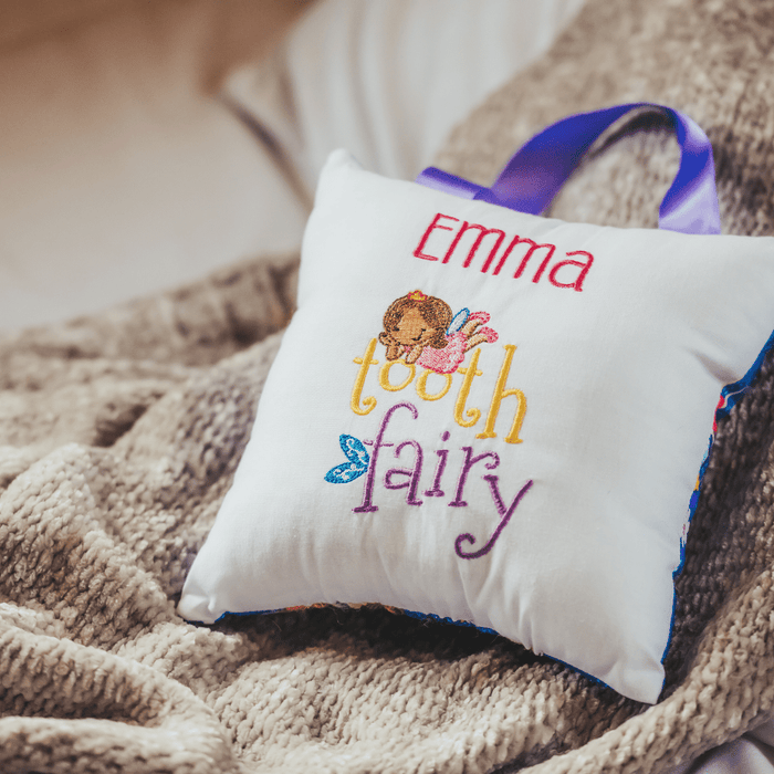 Make losing a tooth an even more magical experience. A tooth fairy pillow will add to the excitement of losing a tooth. This pillow features a beautiful machine embr