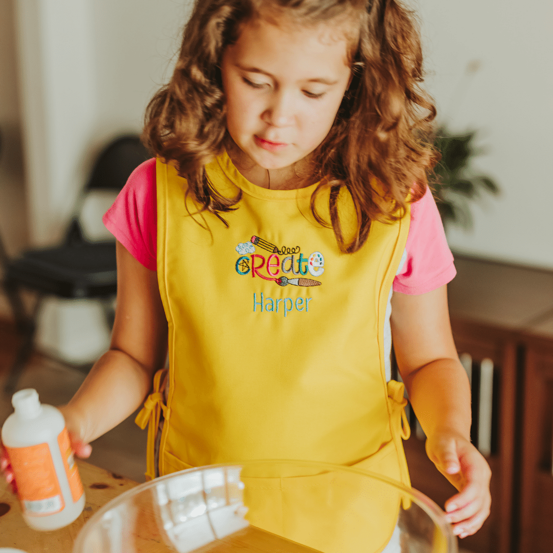 Kids love art! This box is the perfect for the child who loves to explore with art. It features a personalized art smock. Along with 36 watercolor paints, watercolor