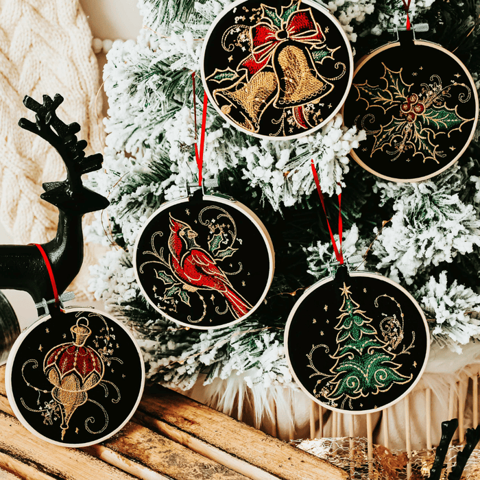 Add a touch of luxurious elegance to your home’s holiday decorations. These beautiful ornaments are embroidered on black fabric and feature metallic embroidery threa