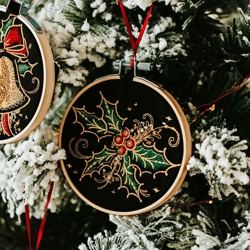 Add a touch of luxurious elegance to your home’s holiday decorations. These beautiful ornaments are embroidered on black fabric and feature metallic embroidery threa