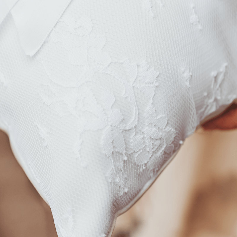 Beautiful ring pillow will be the perfect addition to your wedding. This simple but elegant ring pillow is made with white satin. Features a lace overlay and satin r