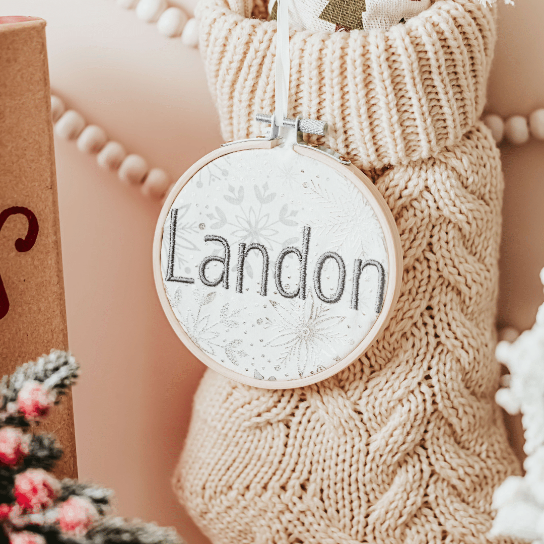 Add a touch of elegance to your Christmas decor with these personalized Christmas stocking tags. Each tag is in a bamboo embroidery hoop with a satin ribbon for hang