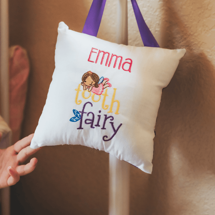 Make losing a tooth an even more magical experience. A tooth fairy pillow will add to the excitement of losing a tooth. This pillow features a beautiful machine embr
