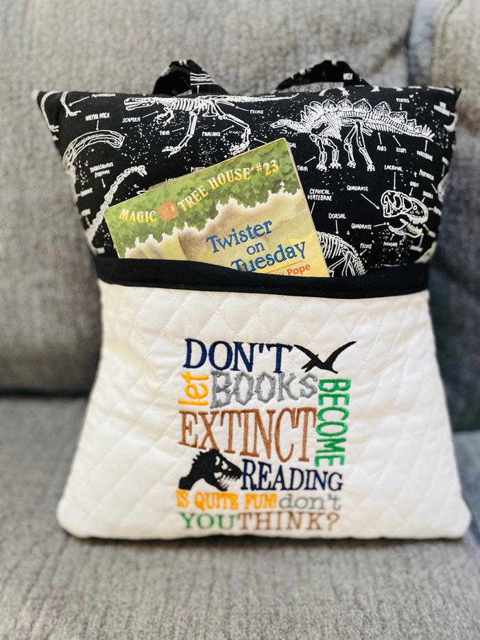 This dinosaur reading pillow is the perfect accessory for young dino enthusiasts who love to read. The pocket on the front allows them to keep their book or tablet s