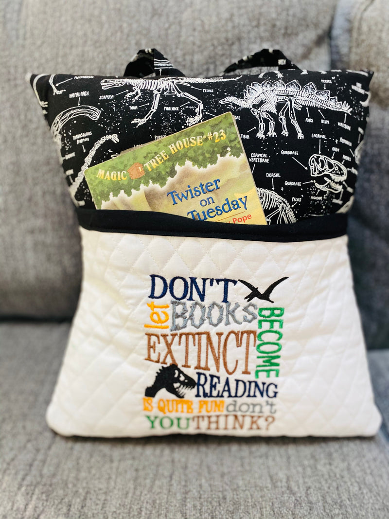 This dinosaur reading pillow is the perfect accessory for young dino enthusiasts who love to read. The pocket on the front allows them to keep their book or tablet s