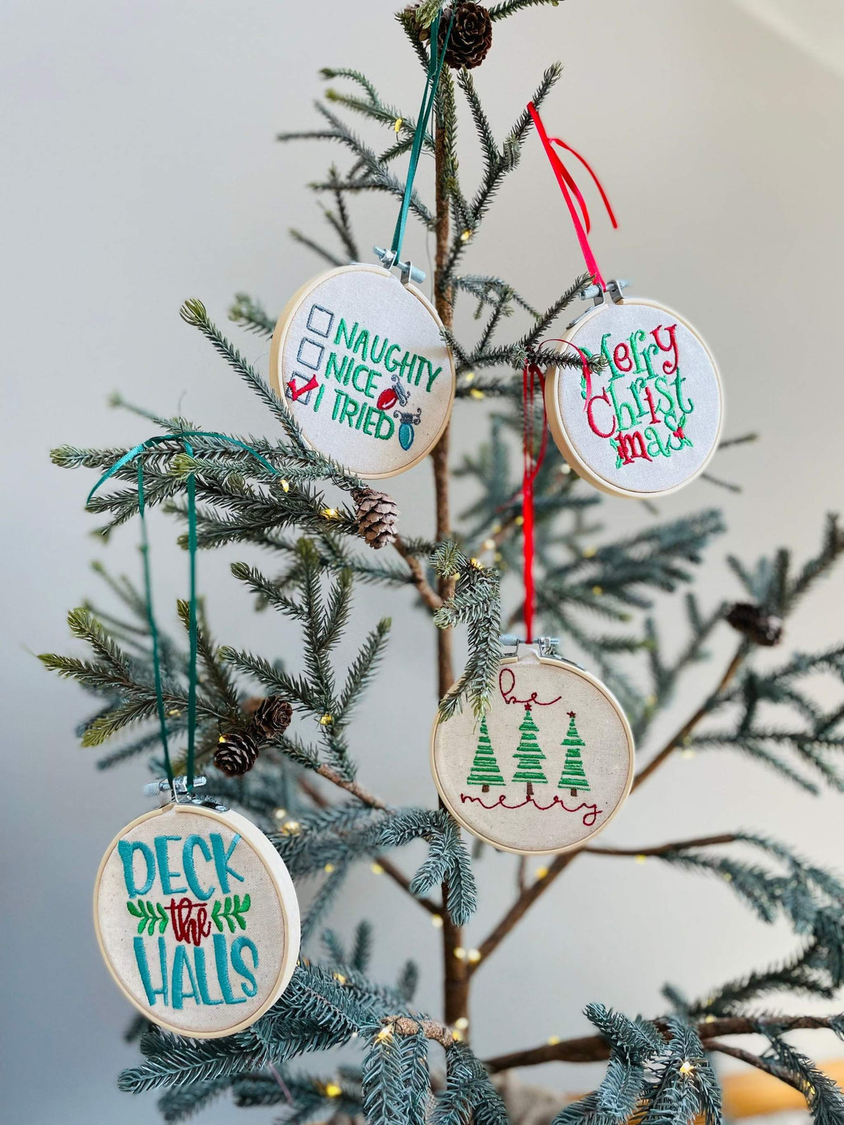 Christmas ornaments are the perfect gift for someone. This ornament is machine embroidered. Features a wooden embroidery hoop. You can use this ornament as a gift ta