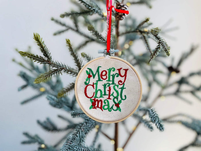 Christmas ornaments are the perfect gift for someone. This ornament is machine embroidered. Features a wooden embroidery hoop. You can use this ornament as a gift ta