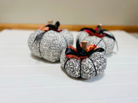 Introducing our set of 3 fabric pumpkins, available in large, medium, and small sizes. These pumpkins are made from a unique black and white swirled fabric, adding a