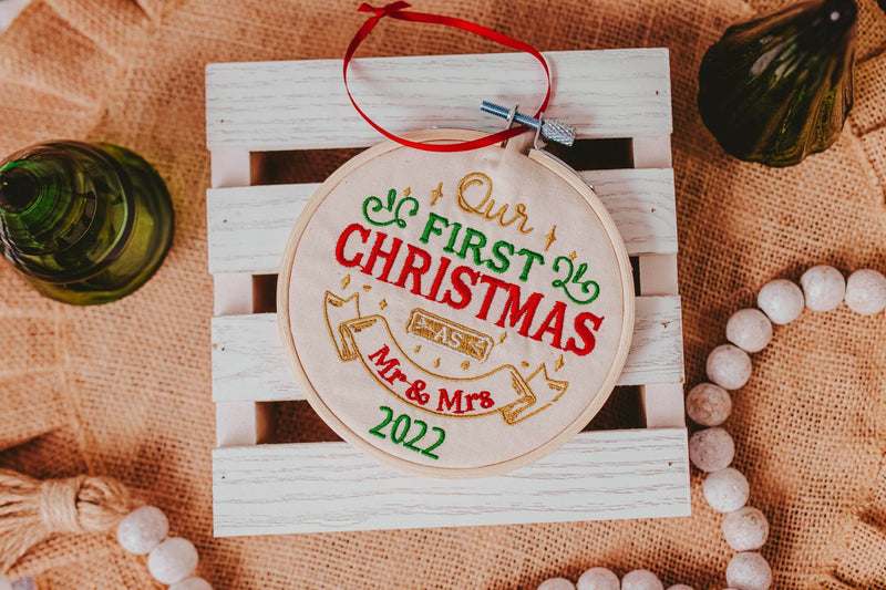 Celebrate your first Christmas together with this beautiful ornament. This machine embroidered ornament features a traditional design and the year of your wedding, m