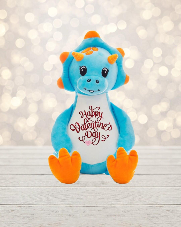 Love is in the air! Surprise your special someone with a cute dinosaur for Valentine's Day. This 18 inch tall blue dinosaur is soft, plush and ready to show how much