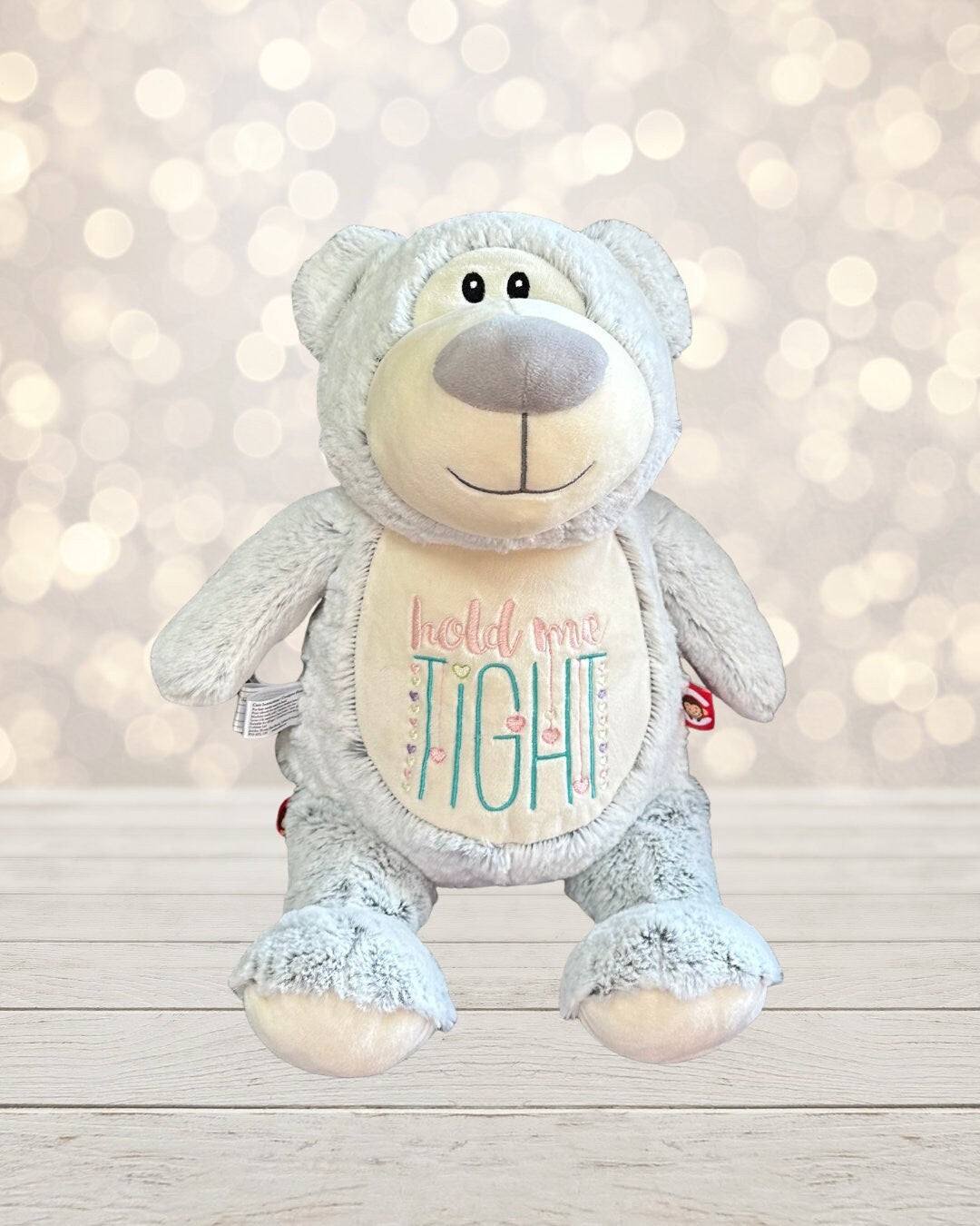 Introducing our 18 inch stuffed gray bear, perfect for snuggling and playtime! With the phrase "hold me tight" embroidered on its belly, this bear is sure to become 