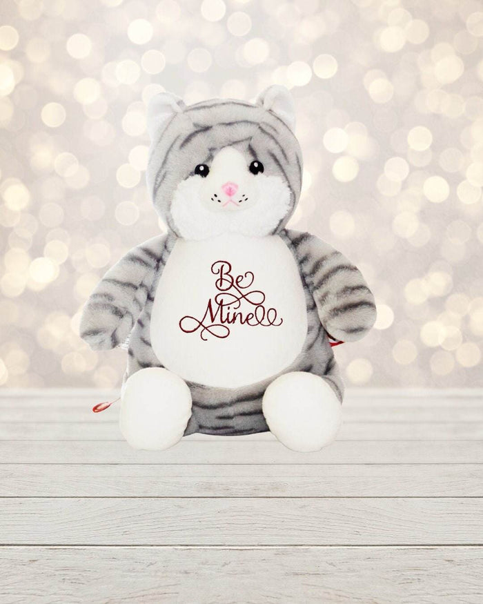Love is in the air! Surprise your special someone with a cute cat for Valentine's Day. This 18 inch tall cat is soft, plush and ready to show how much you care. Feat