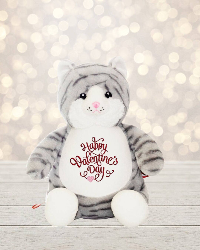 Love is in the air! Surprise your special someone with a cute cat for Valentine's Day. This 18 inch tall cat is soft, plush and ready to show how much you care. Feat