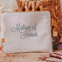 This white canvas makeup bag is a must-have accessory for any matron of honor. Measuring 10.5" x 8" x 1", it's the perfect size to hold all of your makeup essentials