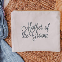 This white canvas makeup bag is a must-have accessory for any mother of the groom. Measuring 10.5" x 8" x 1", it's the perfect size to hold all of your makeup essent