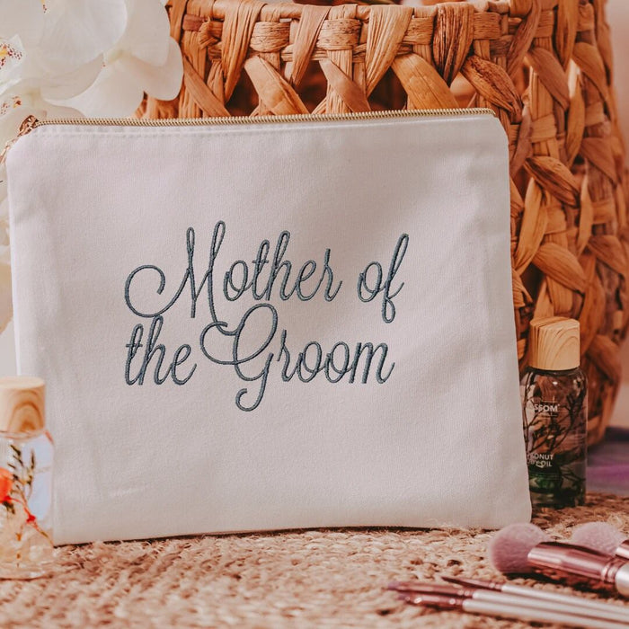 This white canvas makeup bag is a must-have accessory for any mother of the groom. Measuring 10.5" x 8" x 1", it's the perfect size to hold all of your makeup essent