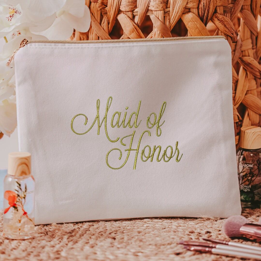 This white canvas makeup bag is a must-have accessory for any maid of honor. Measuring 10.5" x 8" x 1", it's the perfect size to hold all of your makeup essentials, 