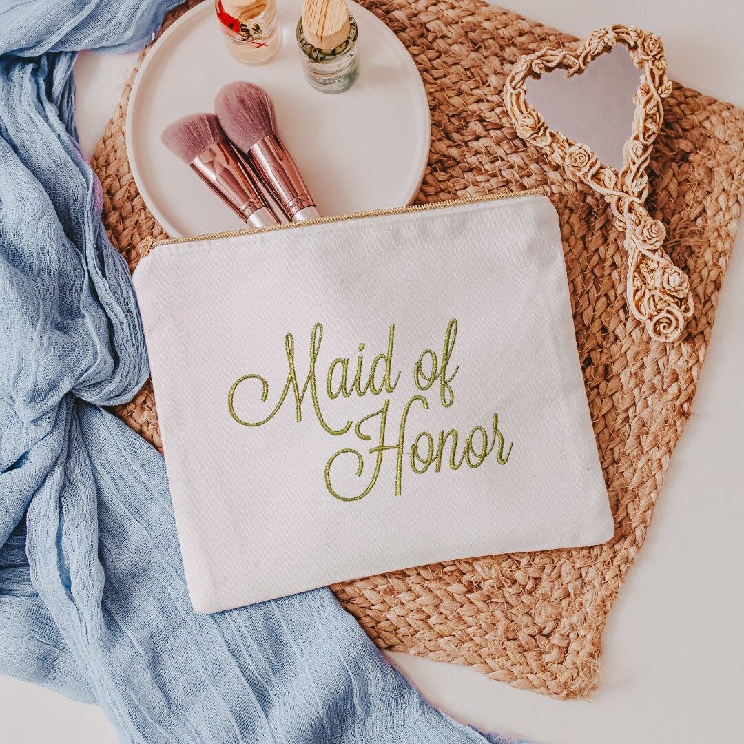 This white canvas makeup bag is a must-have accessory for any maid of honor. Measuring 10.5" x 8" x 1", it's the perfect size to hold all of your makeup essentials, 