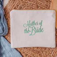 This white canvas makeup bag is a must-have accessory for any mother of the bride. Measuring 10.5" x 8" x 1", it's the perfect size to hold all of your makeup essent