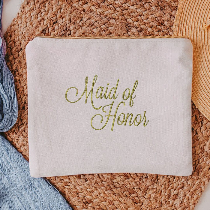This white canvas makeup bag is a must-have accessory for any maid of honor. Measuring 10.5" x 8" x 1", it's the perfect size to hold all of your makeup essentials, 